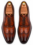 Melodiapelle Malcomb Croc-Panel Wingtip Derby in cognac and dark brown leather, pair top-down view, handcrafted in Agra