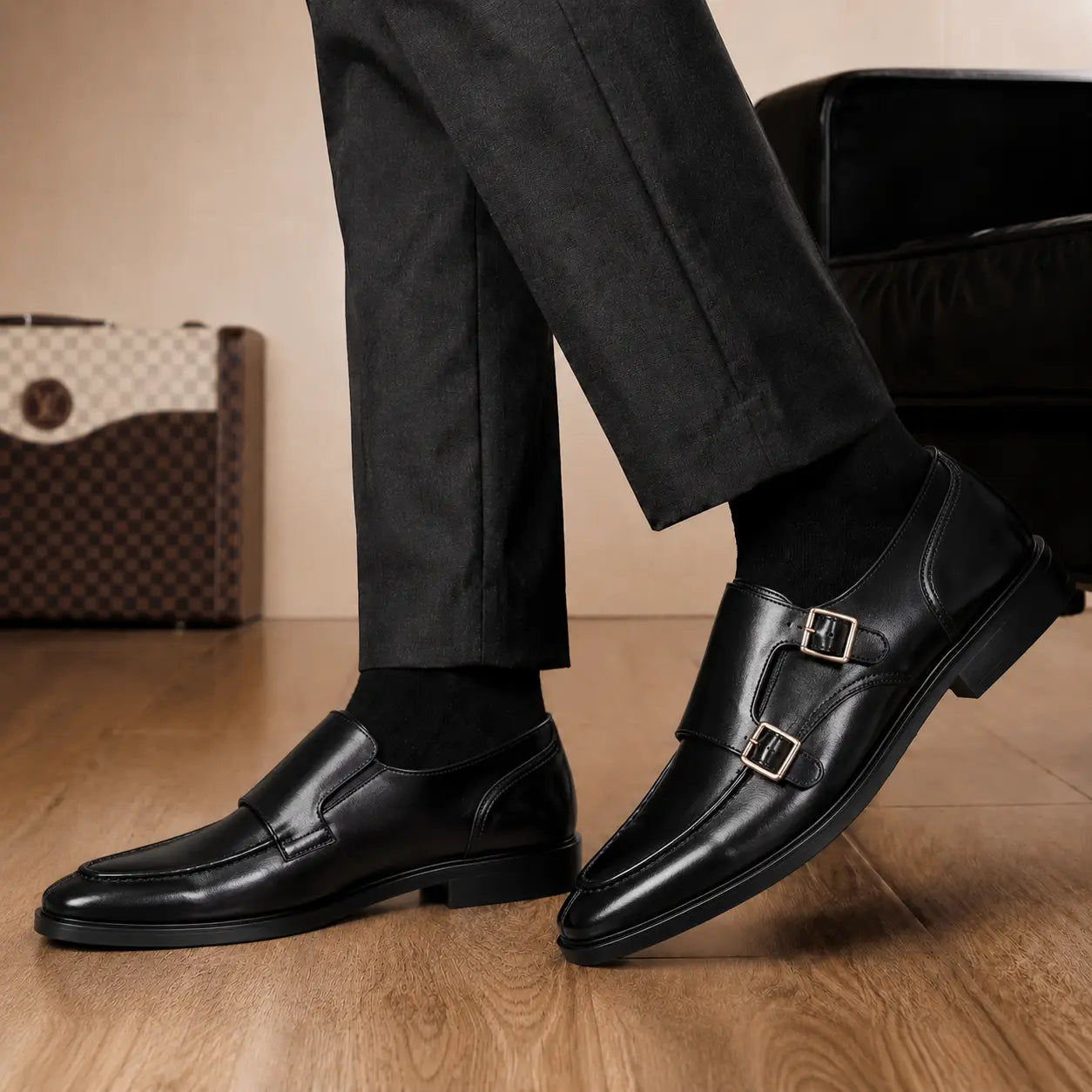 Melodiapelle Malibu Apron Monk Strap in nero black leather worn with formal trousers, on-feet shot