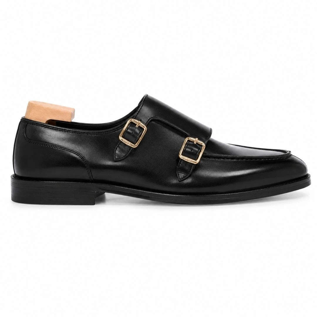 Side profile of the Malibu Apron Monk Strap in nero black leather on white background