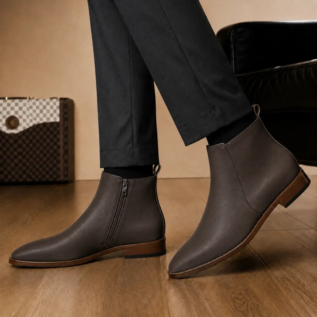 Melodiapelle Malone Zip Ankle Boot in dark brown leather worn with trousers, on-feet shot