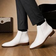 Melodiapelle Malone Zip Ankle Boot in pearl white leather worn with trousers, on-feet shot