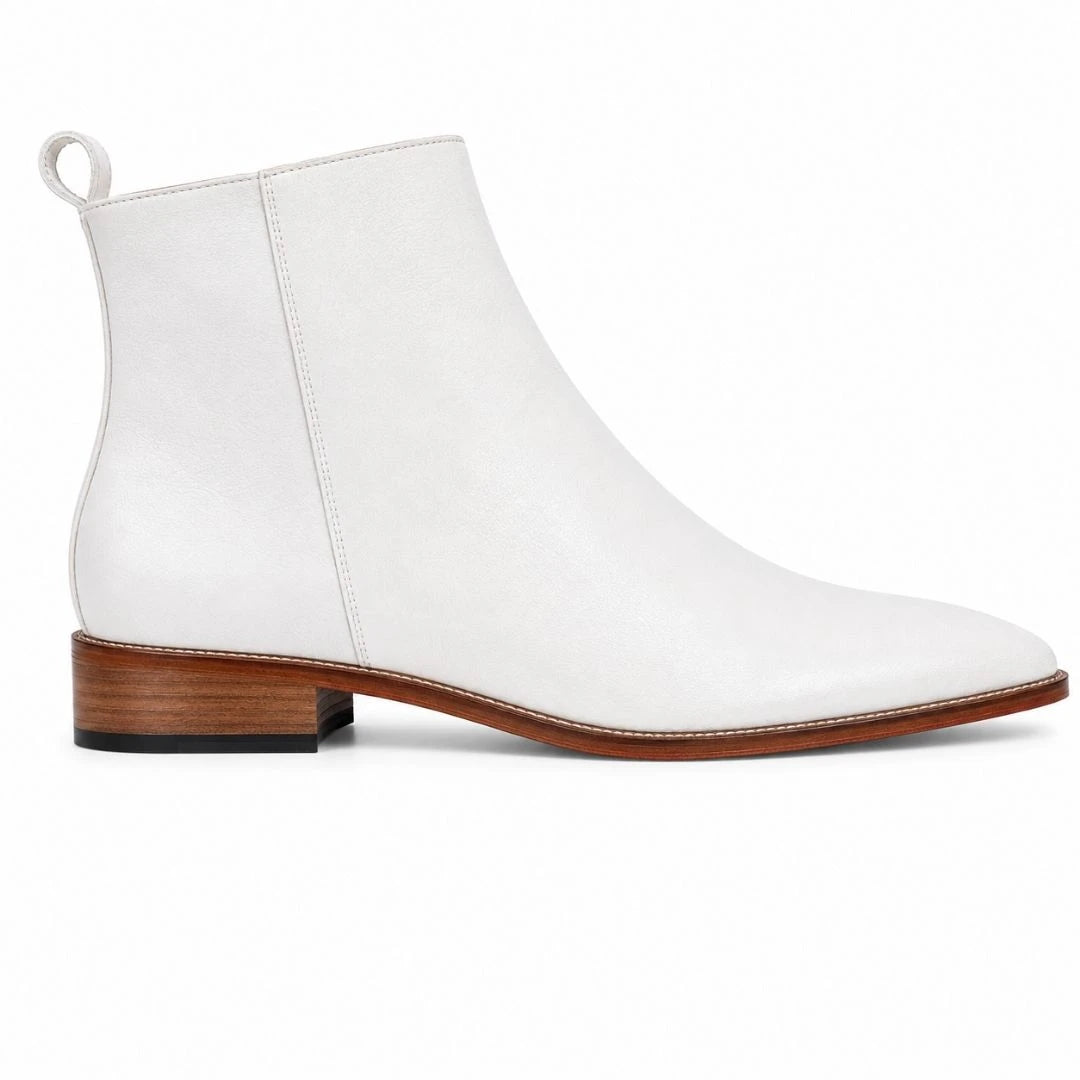 Side profile of the Malone Zip Ankle Boot in pearl white leather on white background