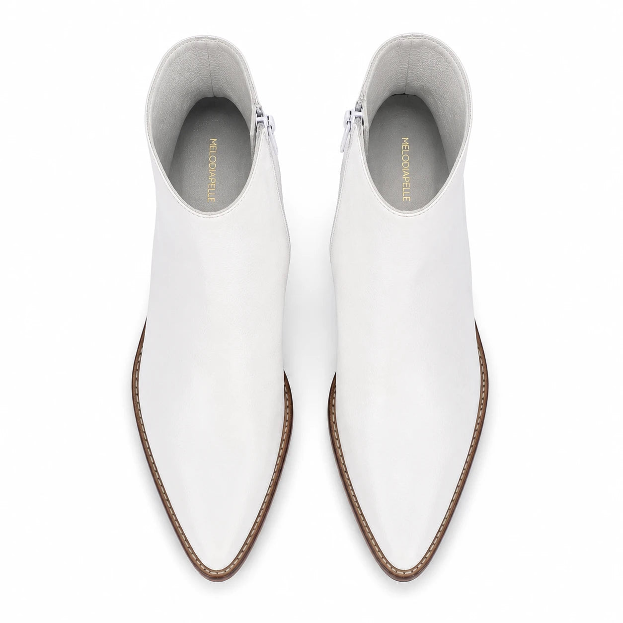Melodiapelle Malone Zip Ankle Boot in pearl white leather, pair top-down view, handcrafted in Agra