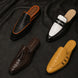 Melodiapelle Malta Mule collection in black, brown and white leather, handcrafted croc-embossed mule shoes displayed together