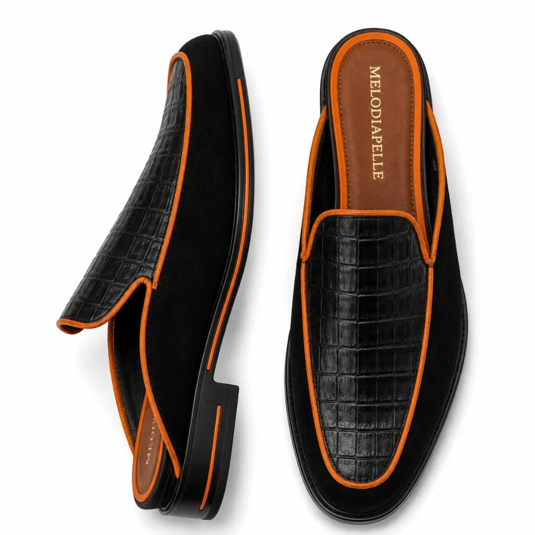Black croc-embossed leather mule with orange piping, three-quarter angle showing heel and trim detailing