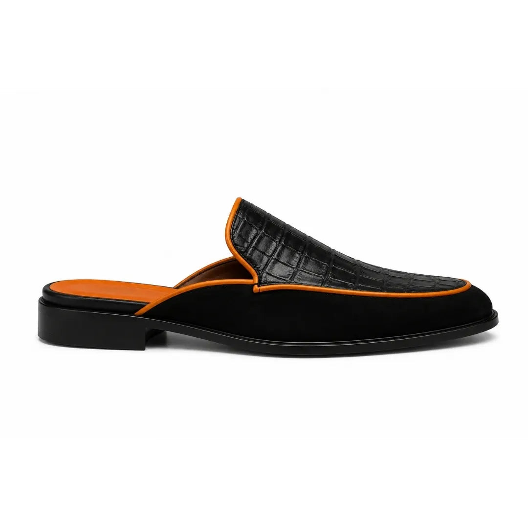 Side profile of the Malta Mule in black croc-embossed leather with orange piping on white background