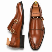 Tan leather apron monk strap shoe, three-quarter angle showing buckles and heel