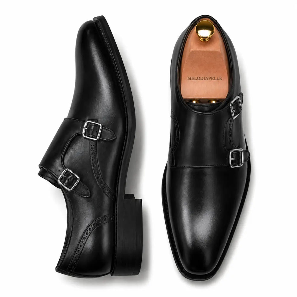 Black leather double monk strap shoe, three-quarter angle showing buckles and heel