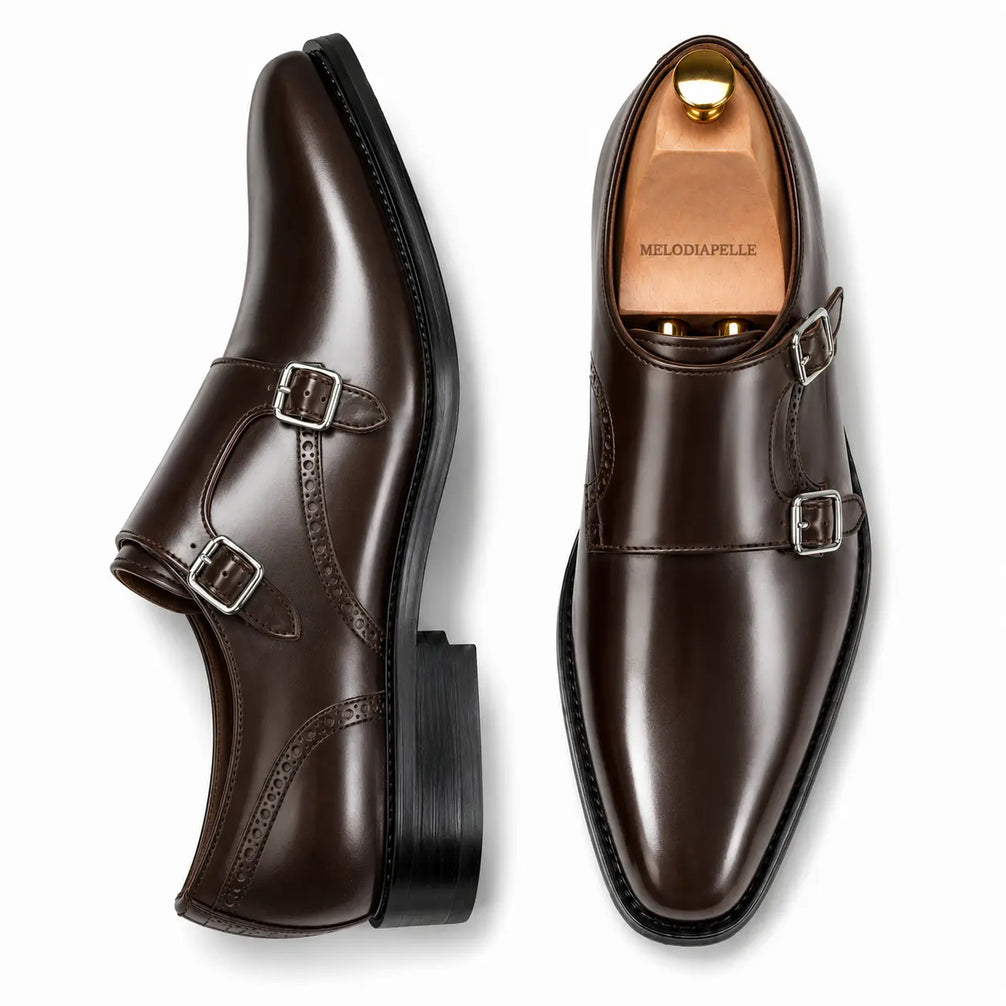 Brown leather double monk strap shoe, three-quarter angle showing buckles and heel