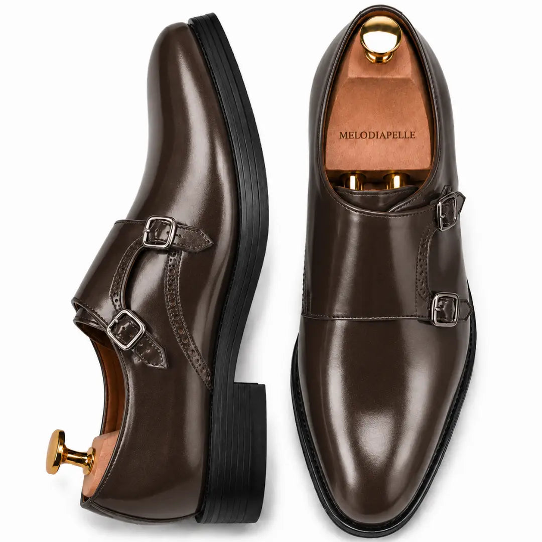Brown leather double monk strap shoe, three-quarter angle showing buckles and heel