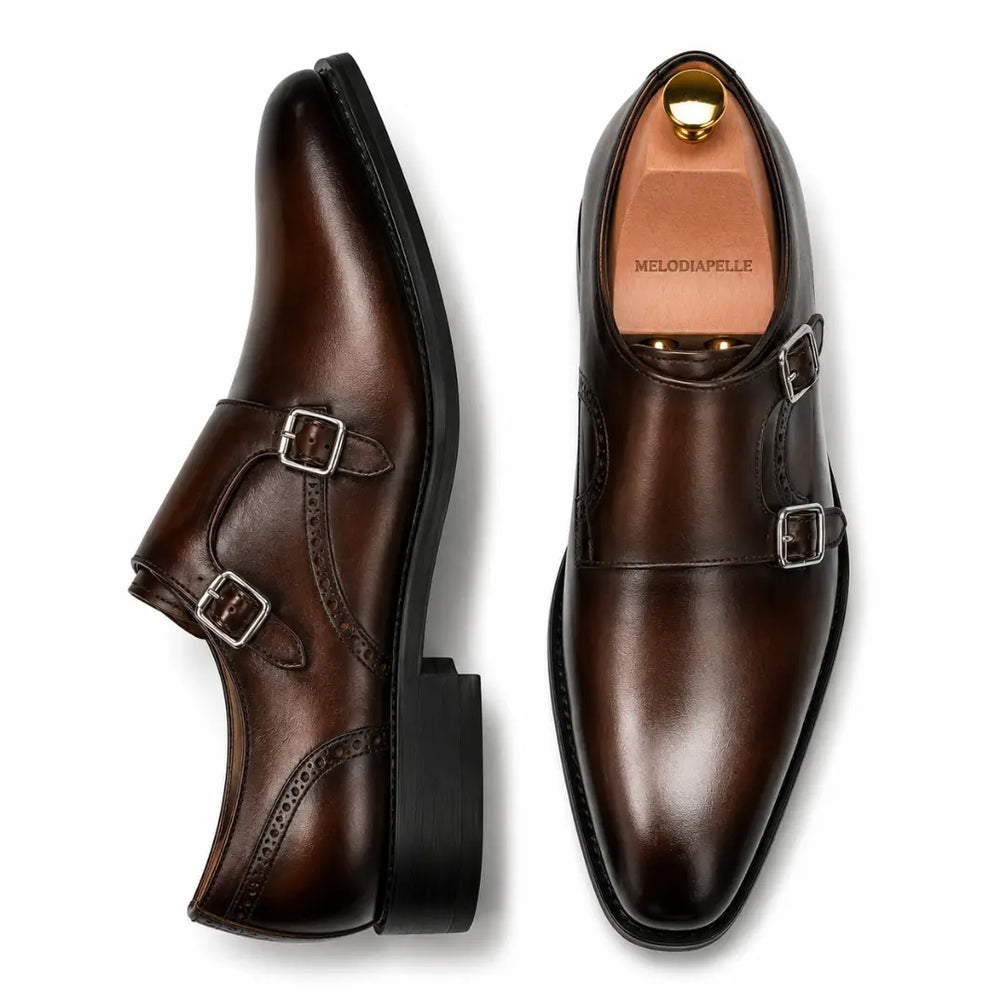 Burgundy leather double monk strap shoe, three-quarter angle showing buckles and heel