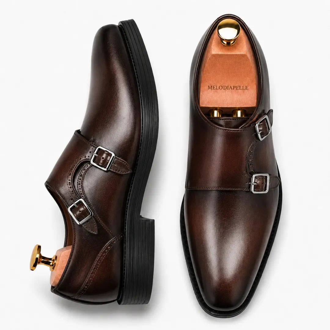 Burgundy leather double monk strap shoe, three-quarter angle showing buckles and heel