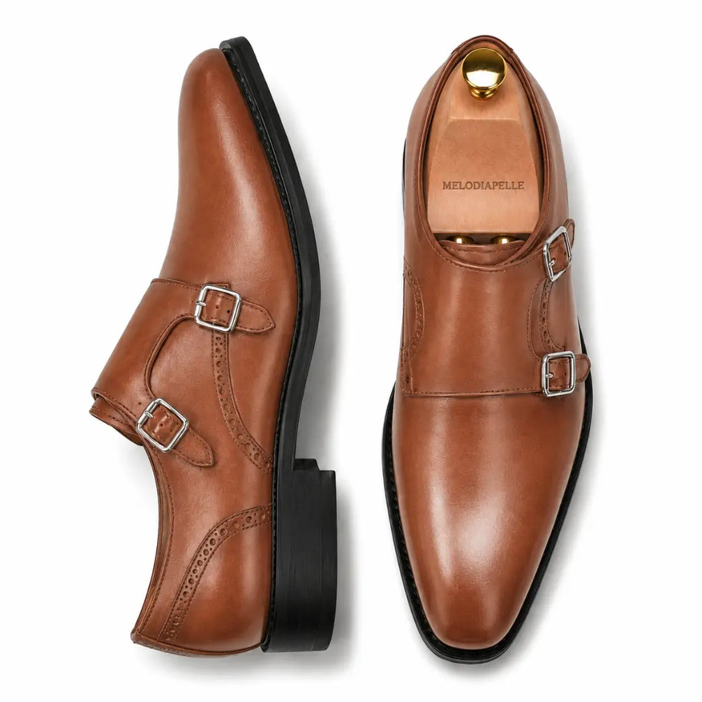 Tan leather double monk strap shoe, three-quarter angle showing buckles and heel