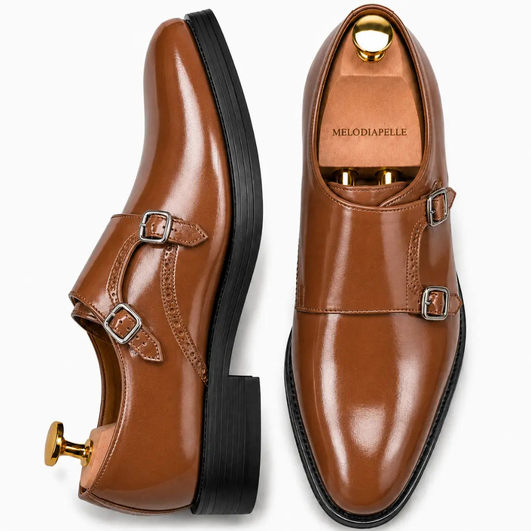 Tan leather double monk strap shoe, three-quarter angle showing buckles and heel