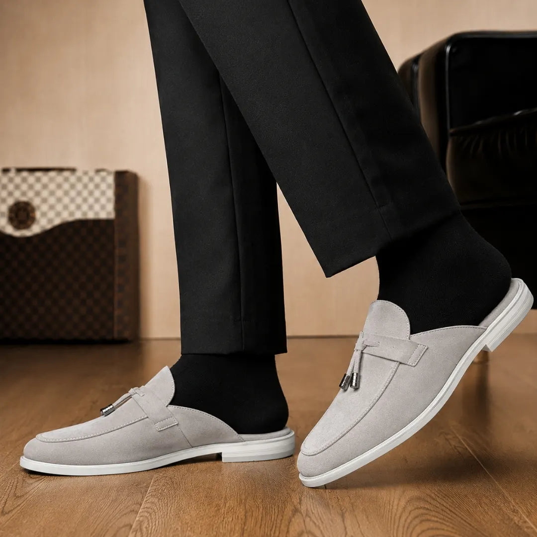 Melodiapelle Mandelli Mule in light grey suede worn with trousers, on-feet shot