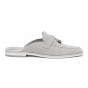 Side profile of the Mandelli Mule in light grey suede on white background
