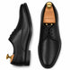 Black leather plain-toe Derby, three-quarter angle showing heel and clean upper