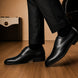 Melodiapelle Mangrove Plain Derby in black leather worn with formal trousers, on-feet shot