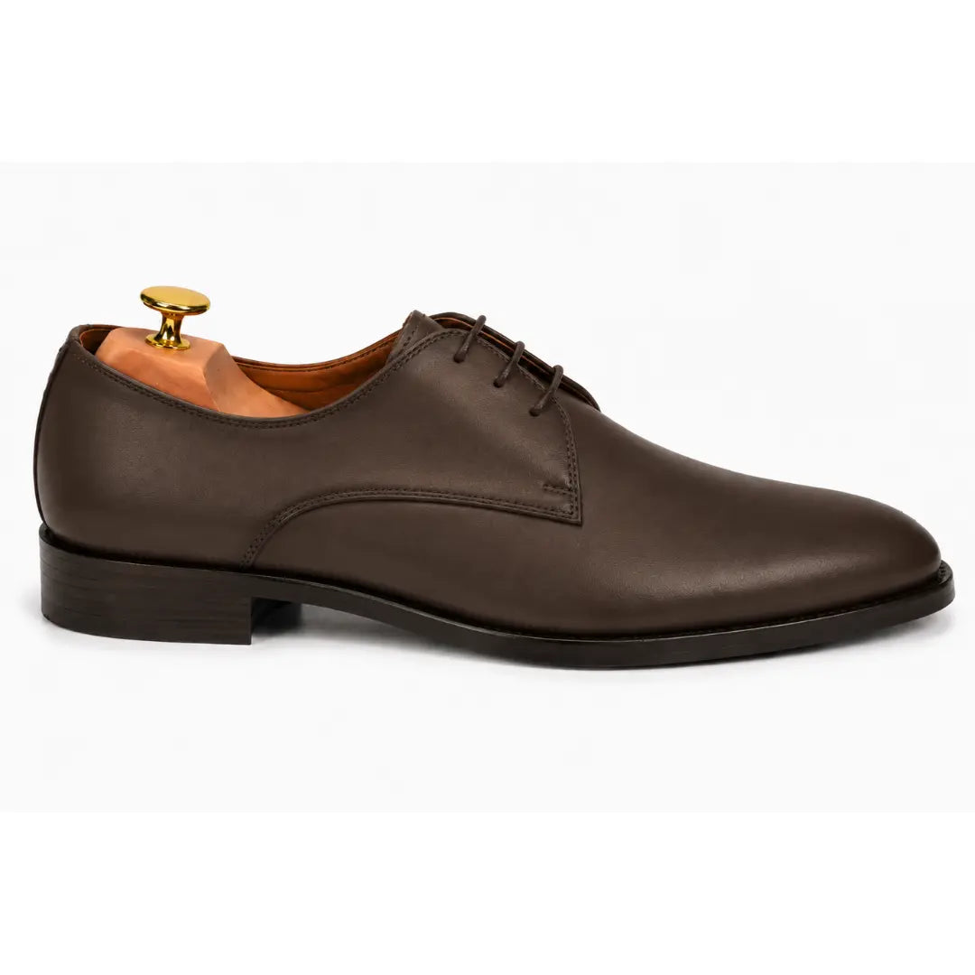 Side profile of the Mangrove Plain Derby in brown leather on white background