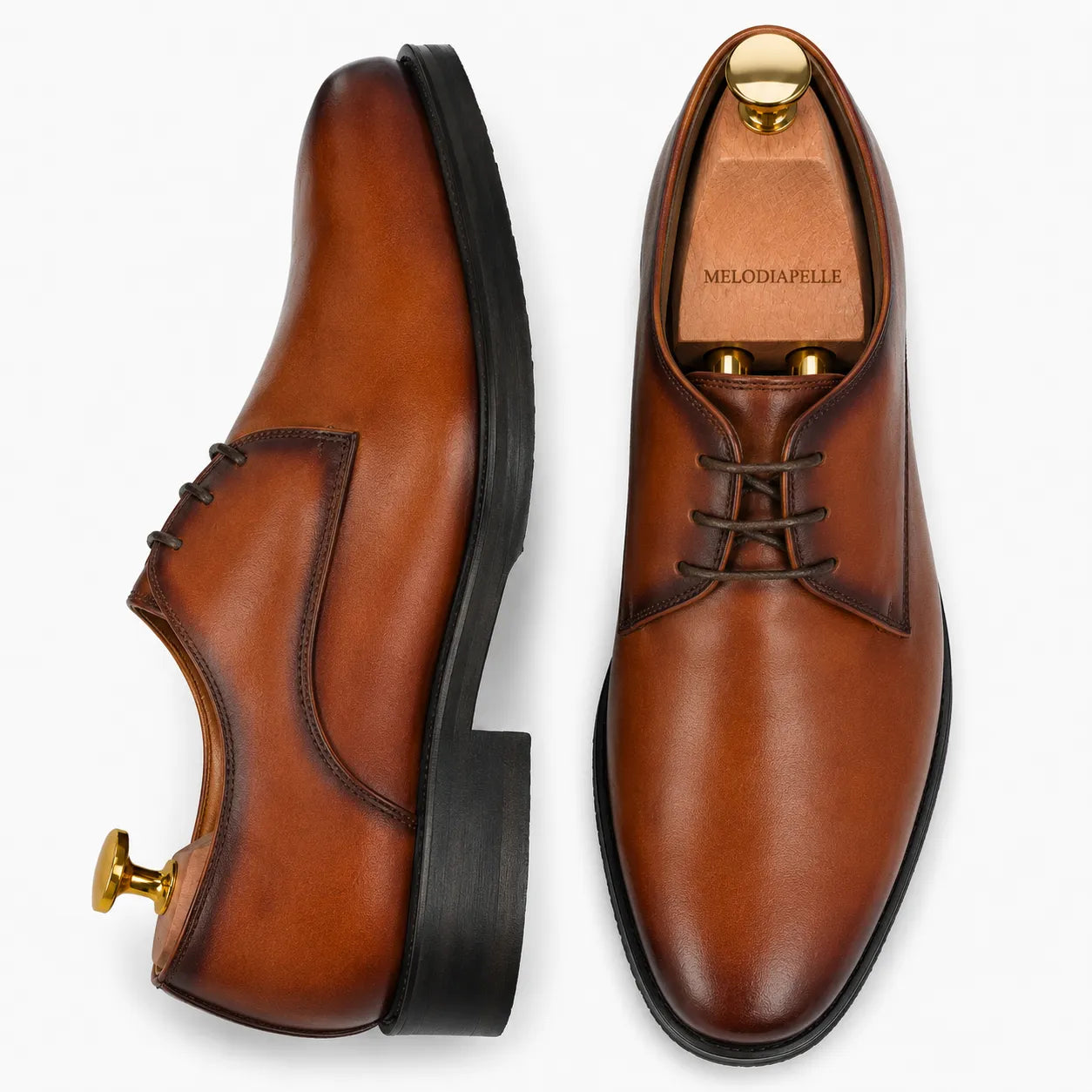 Cognac tan leather plain Derby, three-quarter angle showing heel and Goodyear-welted stitching