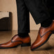 Man wearing Melodiapelle Mangrove Plain Derby in cognac tan with formal trousers, on-feet shot