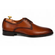 Side profile of the Mangrove Plain Derby in cognac tan leather on white background