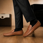 Melodiapelle Manhattan Loafer in rust tan leather worn with trousers, on-feet shot