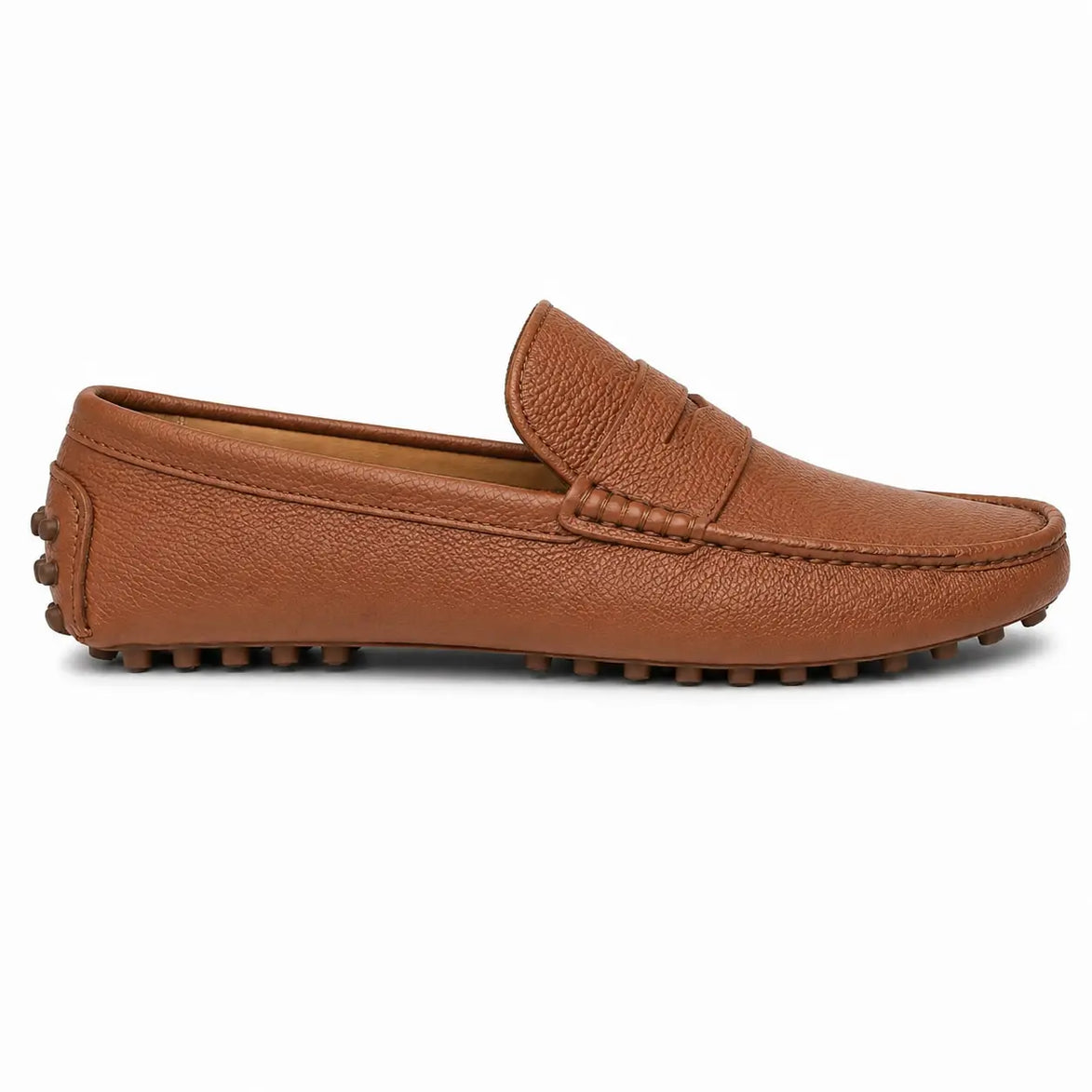 Side profile of the Manhattan Loafer in rust tan leather on white background