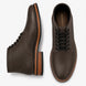 Brown leather plain-toe boot, three-quarter angle showing heel and contrast stitching