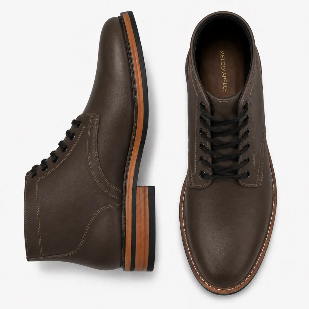 Brown leather plain-toe boot, three-quarter angle showing heel and contrast stitching