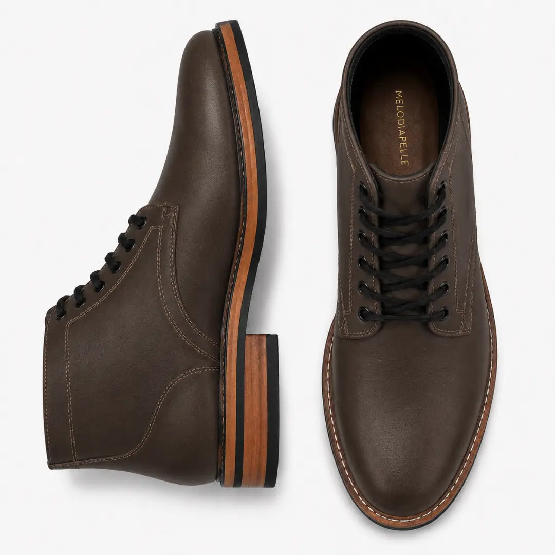 Brown leather plain-toe boot, three-quarter angle showing heel and contrast stitching