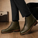 Melodiapelle Manila Plain Toe Boot in olive green leather worn with trousers, on-feet shot