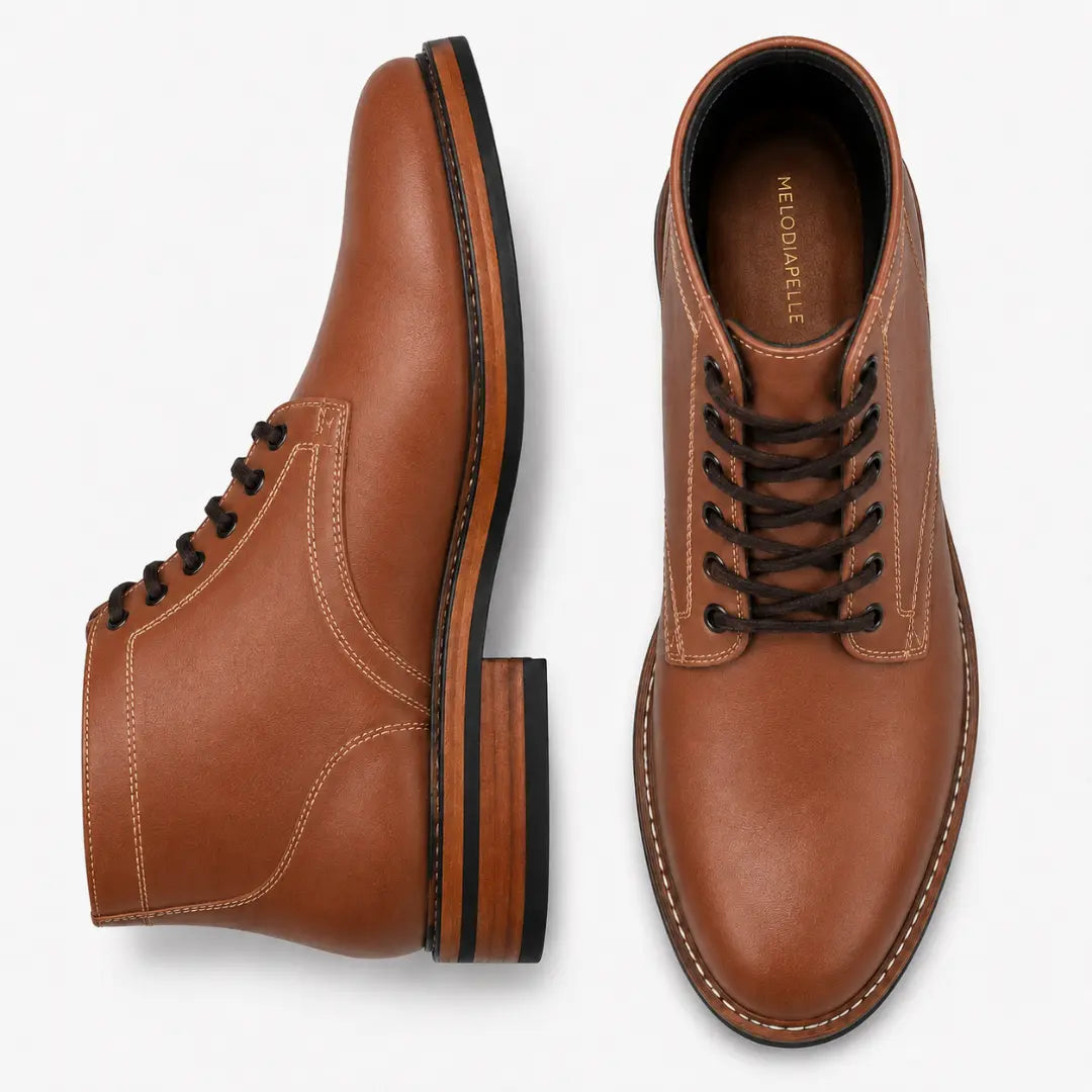 Tan leather plain-toe boot, three-quarter angle showing heel and contrast stitching