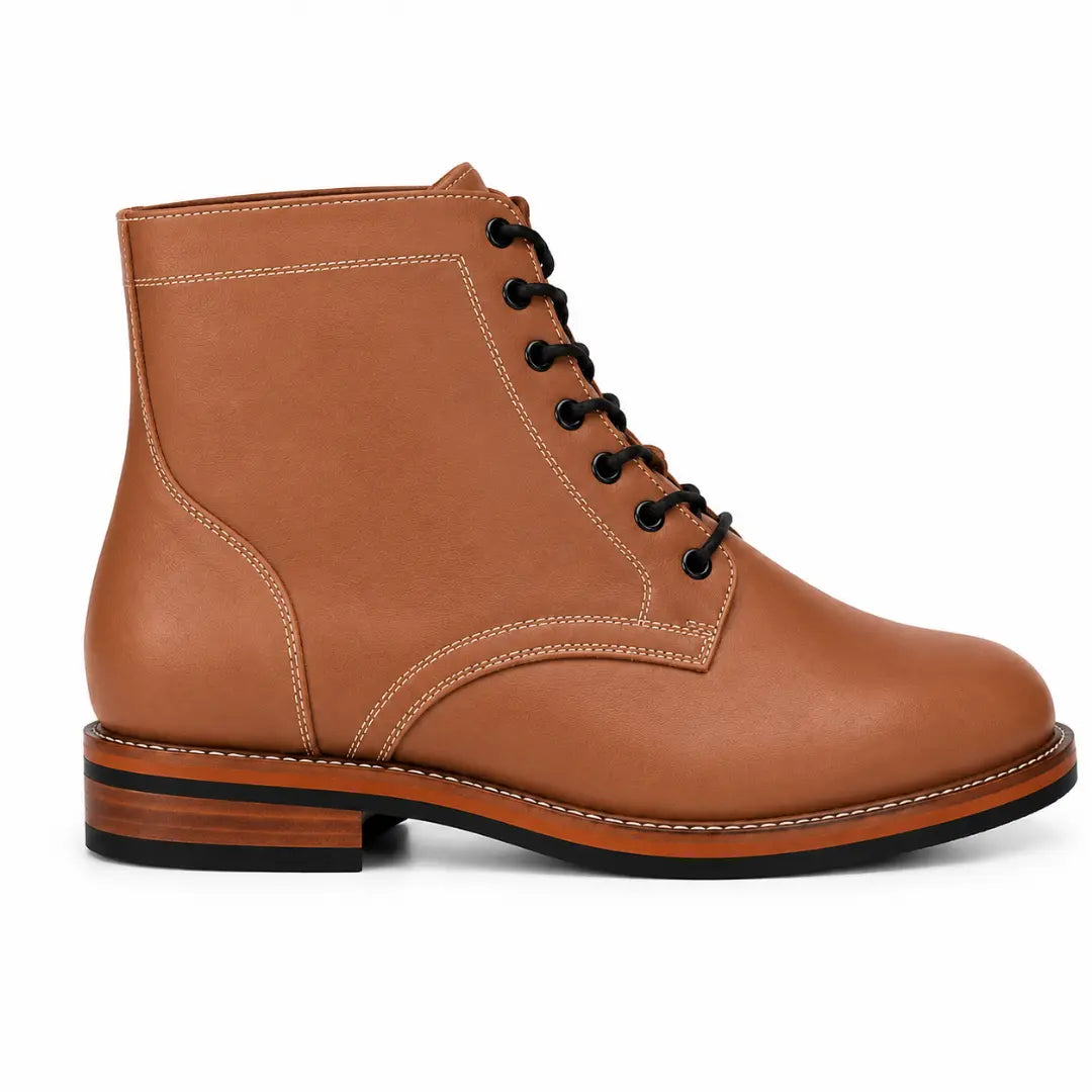 Side profile of the Manila Plain Toe Boot in tan leather on white background