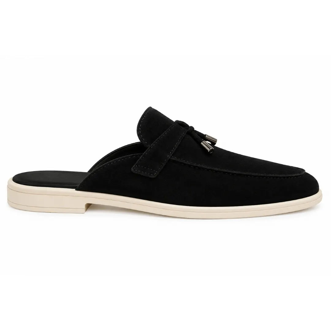 Side profile of the Manni Mule in black suede on white background