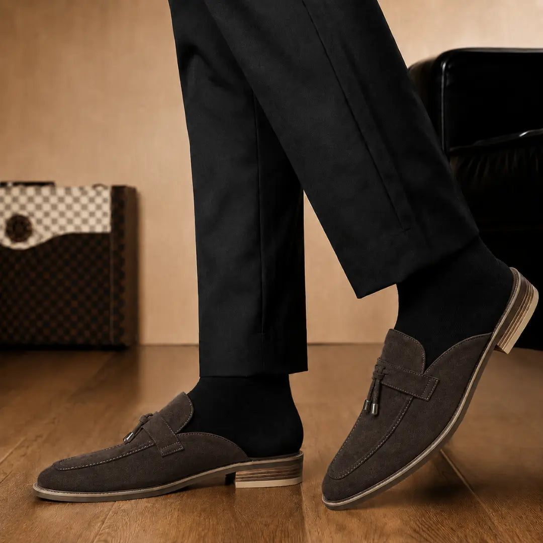 Melodiapelle Manni Mule in dark brown suede worn with trousers, on-feet shot