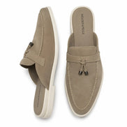 Sand beige suede tassel mule loafer, three-quarter angle showing tassel and heel