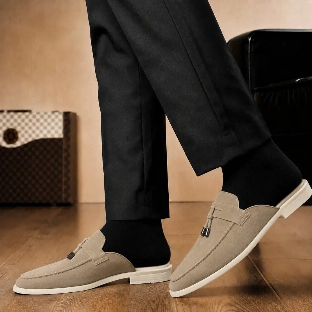 Melodiapelle Manni Mule in sand beige suede worn with trousers, on-feet shot
