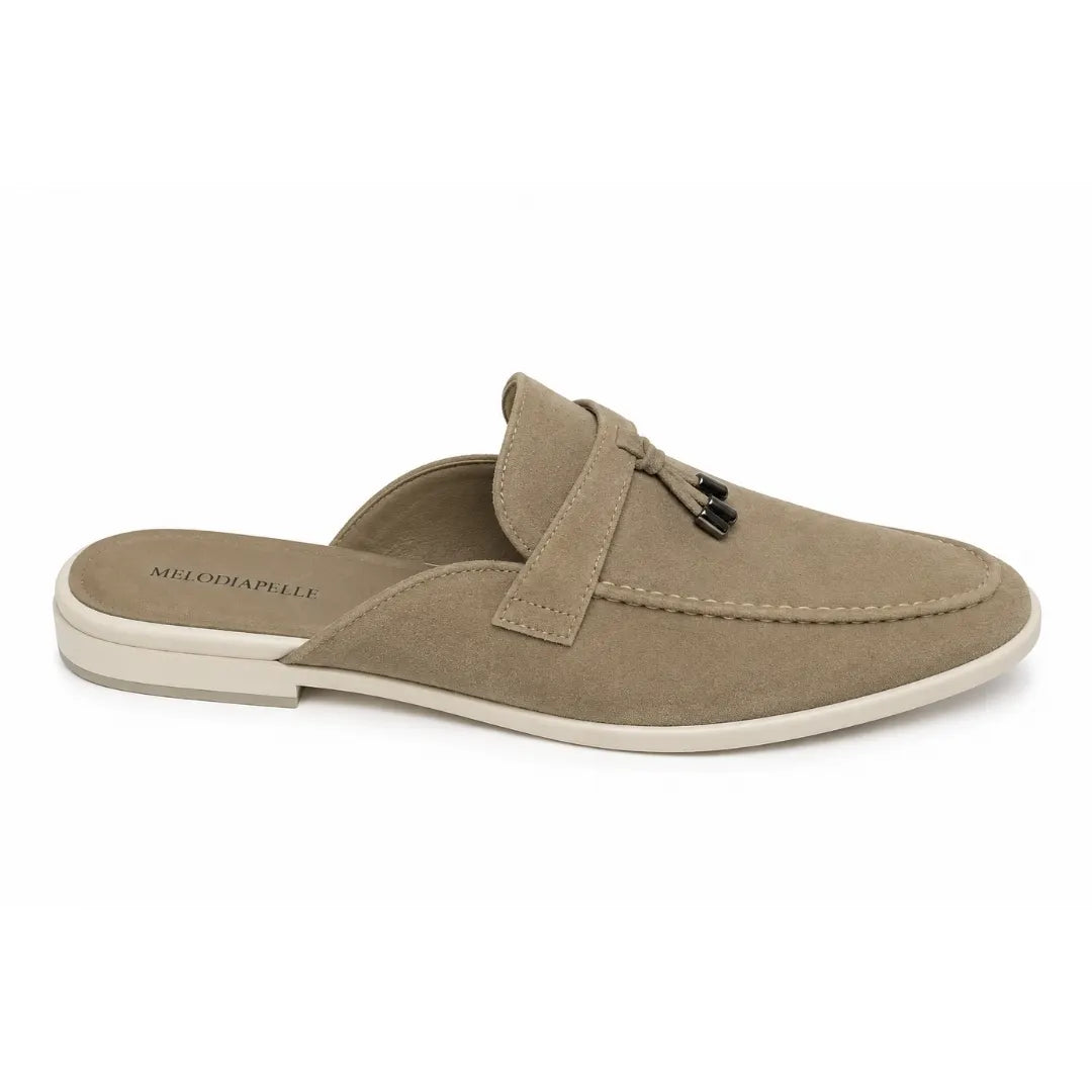 Side profile of the Manni Mule in sand beige suede on white background
