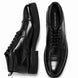 Black leather combat boot, three-quarter angle showing heel and sole detailing