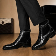 Melodiapelle Manteca Combat Boot in black leather worn with trousers, on-feet shot
