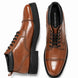 Tan leather combat boot, three-quarter angle showing heel and sole detailing