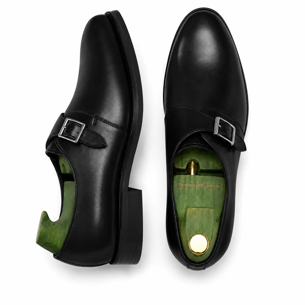 Black leather single monk strap shoe, three-quarter angle showing heel and sole detailing