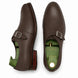 Dark brown leather single monk strap shoe, three-quarter angle showing heel and sole detailing