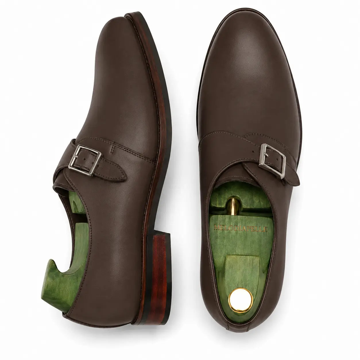 Dark brown leather single monk strap shoe, three-quarter angle showing heel and sole detailing