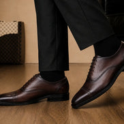 Marcello Semi-Brogue Oxford in chocolate brown leather worn with formal trousers, on-feet lifestyle shot