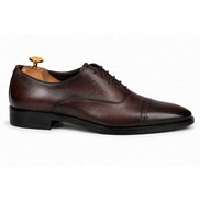Side profile of the Marcello Semi-Brogue Oxford dress shoe in chocolate brown leather on white background