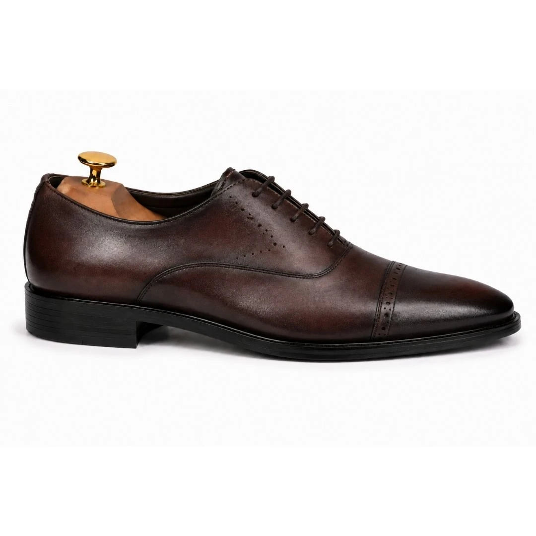 Side profile of the Marcello Semi-Brogue Oxford dress shoe in chocolate brown leather on white background