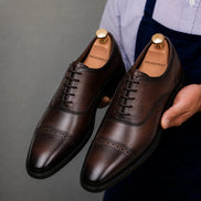 Man wearing Melodiapelle Marcello Semi-Brogue Oxford in chocolate brown, styled close-up