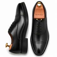 Marcello Semi-Brogue Oxford in black leather, three-quarter angle showing heel and Goodyear-welted stitching